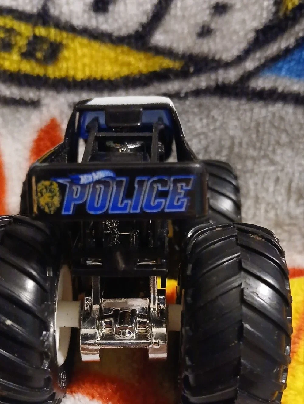 Police Hot Wheels Monster Truck Toy — Black, White & Blue